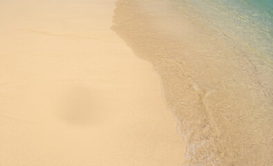 White sand on the seashore as a background