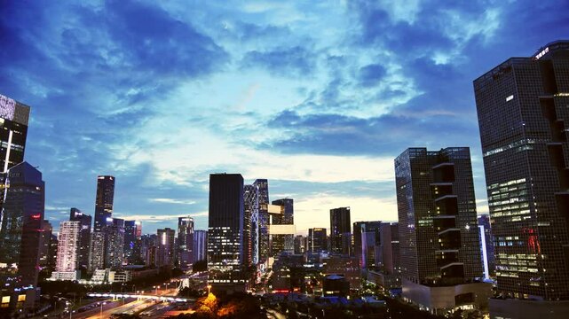 Time lapse of China office buildings in the city at dusk
