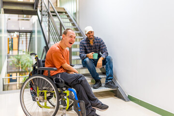 Work mates with disability having fun in a work break