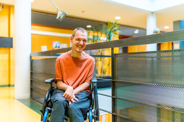 Happy man with cerebral palsy in a modern coworking