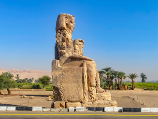 Fototapeta premium Colossi of Memnon, two massive stone statues representing the pharaoh, Luxor, Egypt