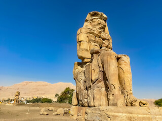 Colossi of Memnon, two massive stone statues representing the pharaoh, Luxor, Egypt