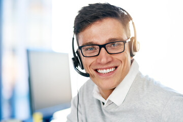 Man, headset and happy in workplace with portrait as virtual assistant, communication staff and employee. Male person, smile and microphone with technical support, call center and customer service