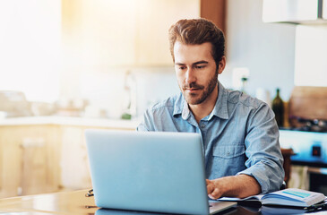 Laptop, kitchen and man typing in home with notebook for research on stock exchange for investment. Computer, information and male trader with online financial market for asset purchase in house.