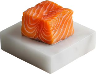 A fresh, delicious piece of salmon fillet on a white marble cutting board.