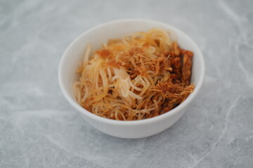 Fried vermicelli noodles in white bowl background