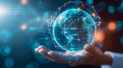 Obraz premium Hand holding digital hologram of Earth with network connections symbolizing global technology connectivity.