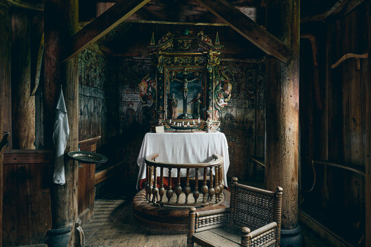 Interior with altar of the Urnes Stave Church, a UNESCO World Heritage Site, by Lustrafjorden in Norway.