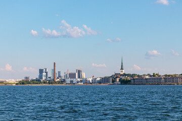 Naklejka premium Tallinn silhouette from distance - sea side. Baltic sea Tallinn bay in front. Clear summer weather - July in Estonia.