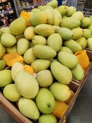 Fresh green mangoes on display