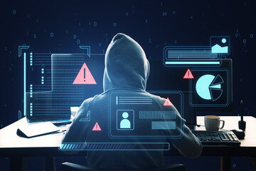 A hacker with a hood in front of a computer, digital graphs and security warning signs, dark blue...