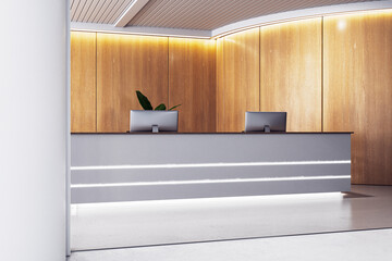 A modern office reception desk with computers, wooden wall panels, and a concept of minimalism, set against a light background. 3D Rendering