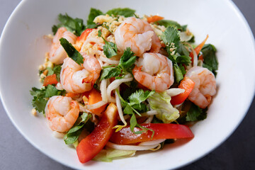 Asian shrimp salad with fresh vegetables on plate