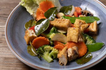 Asian noodles with vegetables on plate