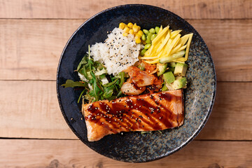 Asian buddha bowl with salmon and vegetables