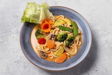 Asian noodles with vegetables on plate
