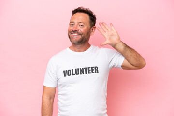 Fototapeta premium Middle age volunteer man isolated on pink background isolated on pink background counting five with fingers