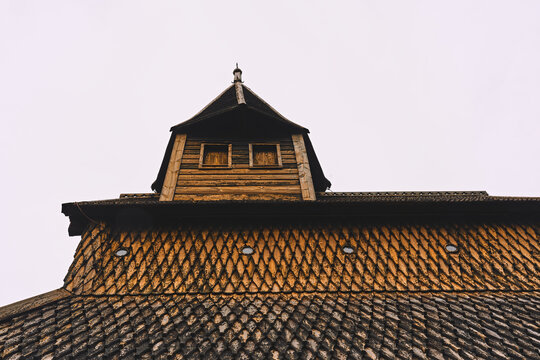Urnes Stave Church, a UNESCO World Heritage Site, by Lustrafjorden in Norway.