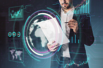 A person interacts with futuristic holographic displays, including a world map and data charts, on a digital background, concept of technology