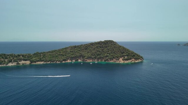Aerial drone view of Nisida Kinira island in Greece in the summer season