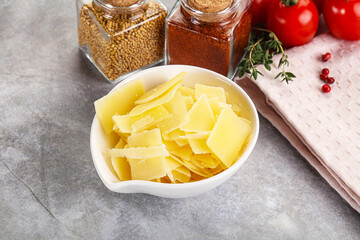 Sliced parmesan cheese in the bowl
