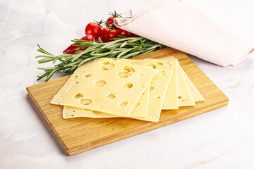 Sliced maasdam cheese with holes