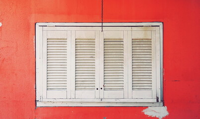 White Window Shutter Red Wall Front View