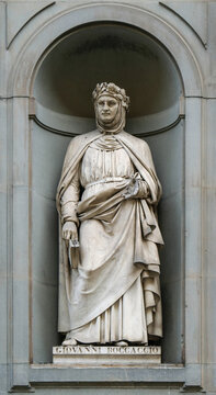 Statue of Giovanni Boccaccio in the niches of the Uffizi Gallery colonnade, Florence, Italy.