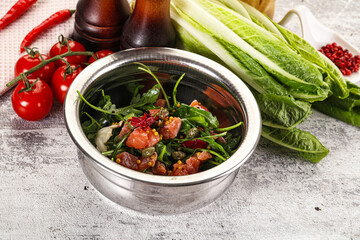 Salad with salmon and arugula