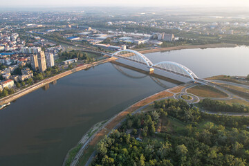Aerial view of railway bridge (Zezeljev Most) over the Danube river on sunny morning. Novi Sad, Serbia.