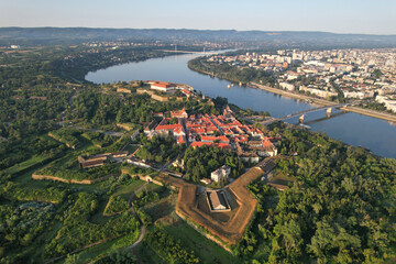 Obraz premium Aerial view of Petrovaradin Fortress, Danube river and Novi Sad on sunny day. Serbia.