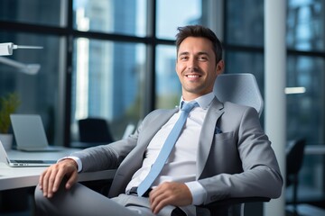 Fototapeta premium A mature adult businessman relaxes in his desk at office.
