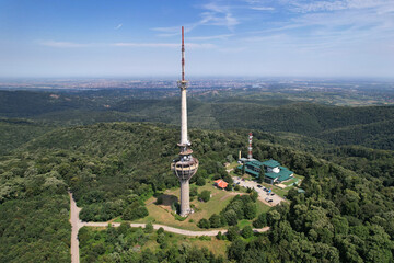 Drone view of Irishki Venac Tower (partly destroyed during the NATO bombing of Yugoslavia) in Frushka Gora national park on sunny day. Serbia.