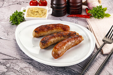 Delicous natural roasted sausages in the plate