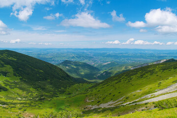 Naklejka premium Beautiful mountain landscape overlooking the valley and the city. Tatra Mountains, Zakopane, Poland. Summer 2024.