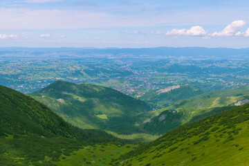 Beautiful mountain landscape overlooking the valley and the city. Tatra Mountains, Zakopane, Poland. Summer 2024.