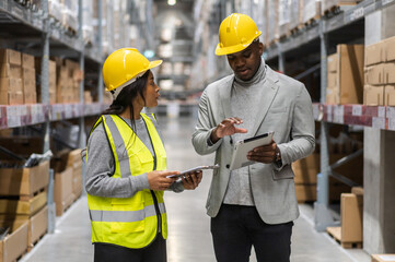 Portrait african american engineer team shipping order detail on tablet export and import,goods,factory,warehouse,international trade,transportation,cargo ship,logistic,distribution.business industry