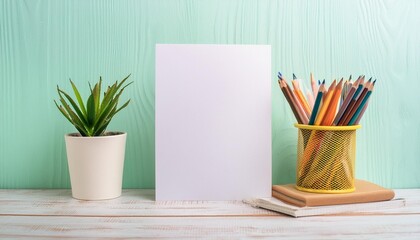 A desk with a blank white paper sheet and a cup of colored pencils.