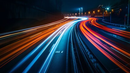 Naklejka premium Stunning long exposure of light trails on a curved highway at night