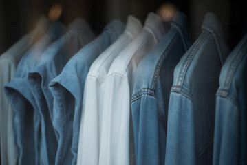 Closeup of blue jeans on hanger in a fashion store showroom