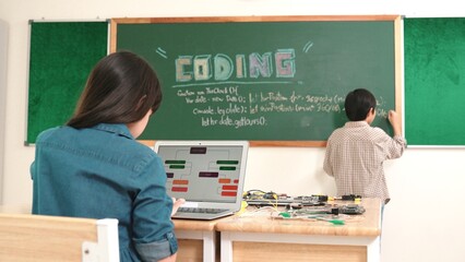 Girl writing engineering prompt by using AI software or programing system to generate AI on table...
