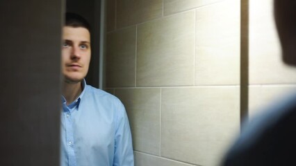 Businessman getting ready for work.
He straightens his shirt, does his hair, looks at himself in the mirror.
Mirror, work, beauty, style, fashion, wash