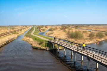 Zaandam, The Netherlands - 7 April 2019: Kruidpad cycle network at Oostzijderveld in North Holland....