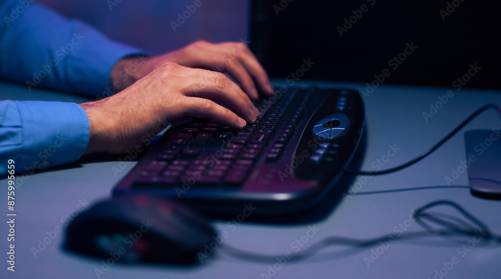 Aufkleber cropped of a persons hands typing on a black keyboard. the image is taken at night, and the light fr