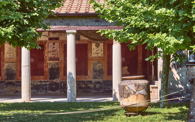 garden with portico and frescoes of a domus in Pompeii