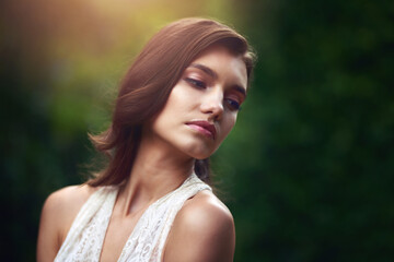 Naklejka premium Woman, thinking and garden with fantasy, fairytale and idea with confidence outdoor. Spring, park and elegant fashion in forest and woods with beauty, natural and sustainable style in nature