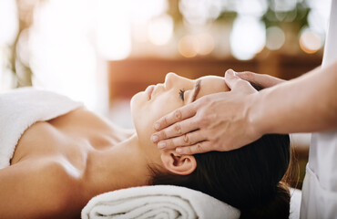 Head massage, hands and woman in spa for relax, calm and treatment for client on bed. Towel, face...