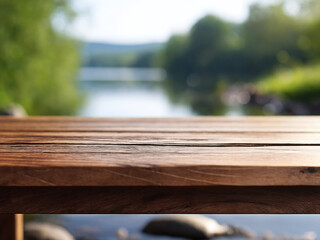 Fototapeta premium Wooden tabletop with blurred lake and green trees background
