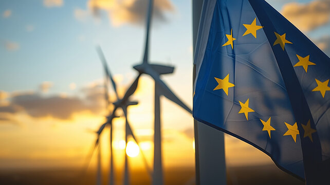 European Union Flag Waving Against Sunset With Wind Turbines in the Background