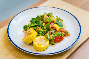 Spicy glass noodle salad on the white plate